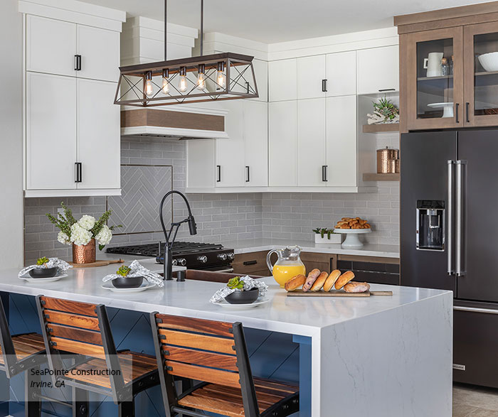 kitchen with white cabinetry and backsplash 